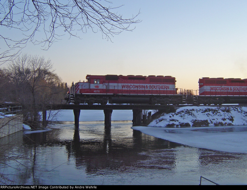 WSOR 4076 leads the JH over Cravath Lake at sunset